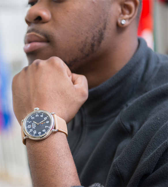 close up of student wrist wearing shinola watch